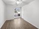 Empty bedroom with light hardwood floors, bright white walls, and a large window at 5509 Copper Trce, North Charleston, SC 29418