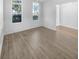 Formal dining room with paneled wainscotting, hardwood floors and windows on 2 walls offering a lot of light at 5509 Copper Trce, North Charleston, SC 29418