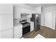 Modern kitchen with stainless steel appliances, white cabinets, and sleek countertops at 5509 Copper Trce, North Charleston, SC 29418