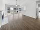Inviting living space with fireplace, sleek floors, neutral paint, and large windows to the backyard at 5509 Copper Trce, North Charleston, SC 29418