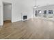 Open living area featuring sleek floors, a fireplace, and sliding glass doors to the backyard at 5509 Copper Trce, North Charleston, SC 29418
