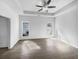 Main bedroom features a tray ceiling, fan, multiple windows for natural light, and neutral walls at 5509 Copper Trce, North Charleston, SC 29418