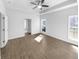 Spacious main bedroom with tray ceiling, fan, large windows and neutral colored walls at 5509 Copper Trce, North Charleston, SC 29418