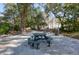 Community green space with picnic tables and mature trees providing shade at 60 Fenwick Hall Aly # 622, Johns Island, SC 29455