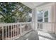 A covered porch with white railings provides an outdoor living space at 60 Fenwick Hall Aly # 622, Johns Island, SC 29455