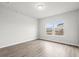 Comfortable bedroom featuring natural light, hardwood floors, and neutral walls at 642 Cottage Landing Dr, Summerville, SC 29485