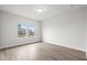 Bright bedroom with hardwood floors and a large window offering plenty of natural light at 642 Cottage Landing Dr, Summerville, SC 29485