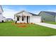 Charming single-story home with a well-manicured lawn and attached garage at 642 Cottage Landing Dr, Summerville, SC 29485
