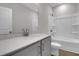 Bathroom featuring white vanity with gray cabinets and countertop, and a bathtub-shower combo with a toilet at 642 Cottage Landing Dr, Summerville, SC 29485