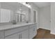 Bathroom featuring double vanity with grey cabinets, white countertop, and a shower with a glass door at 642 Cottage Landing Dr, Summerville, SC 29485