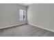 Bedroom featuring gray carpet, neutral paint, and a large window for lots of natural light at 642 Cottage Landing Dr, Summerville, SC 29485