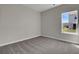 Bedroom featuring gray carpet, neutral paint, and large windows for lots of natural light at 642 Cottage Landing Dr, Summerville, SC 29485