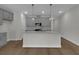 Bright, modern kitchen with a large island, gray cabinetry, and stainless steel appliances at 642 Cottage Landing Dr, Summerville, SC 29485