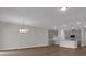 Bright living room featuring an open concept, wood floors, a modern chandelier and kitchen views at 642 Cottage Landing Dr, Summerville, SC 29485