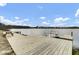 A wooden dock leads out to the lake, with seating and boat access for residents at 661 Black Pine Rd, Moncks Corner, SC 29461