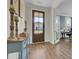 Welcoming foyer with hardwood floors and decorative console table at 661 Black Pine Rd, Moncks Corner, SC 29461