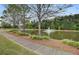 Scenic pond with fountain and a walking path lined with trees providing relaxing views for the community at 661 Black Pine Rd, Moncks Corner, SC 29461