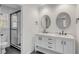 Bathroom featuring double vanity, marble countertop, and glass-enclosed shower at 704 N Godfrey Park Pl, Charleston, SC 29407