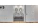 Modern bathroom features dual sinks, marble countertop, and stylish fixtures at 704 N Godfrey Park Pl, Charleston, SC 29407
