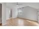 Spacious bedroom features hardwood floors, a large window, and ample natural light at 704 N Godfrey Park Pl, Charleston, SC 29407