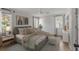Light and airy bedroom with neutral tones, ceiling fan, and ample natural light at 704 N Godfrey Park Pl, Charleston, SC 29407