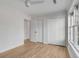 Bedroom featuring hardwood floors, closet, and natural light from a window at 704 N Godfrey Park Pl, Charleston, SC 29407