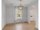 Elegant dining room with hardwood floors, wainscoting, and natural light at 704 N Godfrey Park Pl, Charleston, SC 29407