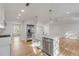 Kitchen island with stainless appliances, white cabinets and quartz countertop at 704 N Godfrey Park Pl, Charleston, SC 29407