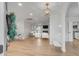 Bright open-concept living room with hardwood floors and modern furnishings at 704 N Godfrey Park Pl, Charleston, SC 29407