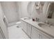 Contemporary bathroom featuring dual sinks, modern lighting, and a walk-in shower at 7631 Indigo Palms Way, Johns Island, SC 29455