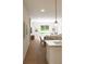 Open concept living and dining space with hardwood floors and natural light at 7631 Indigo Palms Way, Johns Island, SC 29455