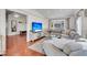 Sun-filled living room featuring a large sectional sofa, hardwood floors, and an open layout at 817 Savage Rd, Charleston, SC 29407