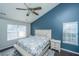 Bedroom with vaulted ceiling, large window, and neutral paint scheme at 8512 Kennestone Ln, Charleston, SC 29420