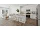 Bright open concept kitchen with granite countertops, stainless steel appliances, and a view to the living area at 8758 Silver Perch Ln, North Charleston, SC 29420