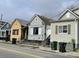 Charming street view of quaint homes with colorful facades and a vintage aesthetic at 90 Romney St, Charleston, SC 29403