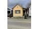 Cozy yellow house with black trim, offering a classic design and a welcoming entrance at 90 Romney St, Charleston, SC 29403