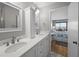 Bathroom featuring double vanity sinks, white cabinets and bedroom view at 9002 Palmetto Drive #514 1/13 Share, Isle of Palms, SC 29451