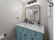 Bathroom with marble vanity, painted blue cabinet, updated fixtures and ornate accents at 9002 Palmetto Drive #514 1/13 Share, Isle of Palms, SC 29451