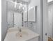 Bathroom featuring single sink vanity and large mirror at 9002 Palmetto Drive #514 1/13 Share, Isle of Palms, SC 29451