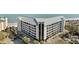 An eye-level exterior view of a condominium showcasing its architecture, balconies, and proximity to the beach at 9002 Palmetto Drive #514 1/13 Share, Isle of Palms, SC 29451