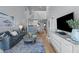 Bright and airy living room with an open layout, spiral staircase, and a modern coastal aesthetic at 9002 Palmetto Drive #514 1/13 Share, Isle of Palms, SC 29451
