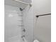 Updated bathroom featuring a shower with white subway tile surround, glass shelves and modern fixtures at 9002 Palmetto Drive #514 1/13 Share, Isle of Palms, SC 29451