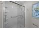 Glass enclosed shower with white tile and safety bars at 9002 Palmetto Drive #514 1/13 Share, Isle of Palms, SC 29451