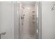 Updated shower featuring tiled walls, a glass door, and a shower head with handheld wand at 9002 Palmetto Drive #514 1/13 Share, Isle of Palms, SC 29451