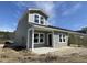 New construction home with gray siding, covered porch, and modern windows at 915 Dusk Dr, Summerville, SC 29486