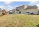 Large fenced yard with a play structure, and a view of the home's back exterior at 9620 Pebble Creek Blvd, Summerville, SC 29485