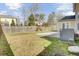Large fenced backyard with a small patio area and play structure, ready for outdoor activities at 9620 Pebble Creek Blvd, Summerville, SC 29485