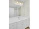 This bathroom is well lit and features a shower tub and a large mirror over the vanity at 9620 Pebble Creek Blvd, Summerville, SC 29485