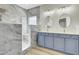 Bathroom featuring a luxe walk-in shower, updated vanity, and modern double sinks at 9620 Pebble Creek Blvd, Summerville, SC 29485