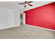 Second bedroom with closet and neutral carpet offers flexible space for guests or a home office at 9620 Pebble Creek Blvd, Summerville, SC 29485